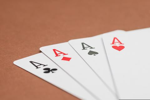 Bhabhi free online multiplayer game — four aces fanned out on a table