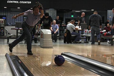 Ten-Pin Bowling free online multiplayer game — bowler releasing a ball down a bowling lane