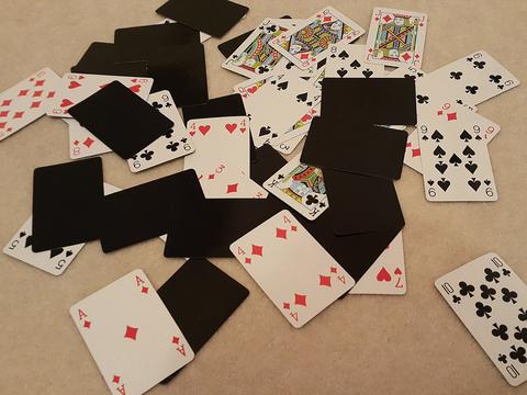 Canasta free online multiplayer game — playing cards spread across a table