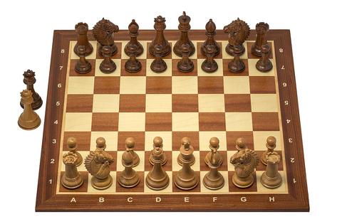 Chess free online multiplayer game — wooden chess set with pieces on the board