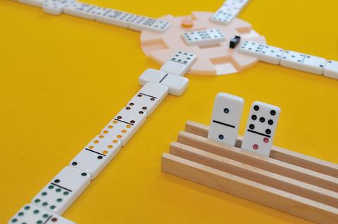 Dominoes free online multiplayer game — domino train laid out on a yellow table