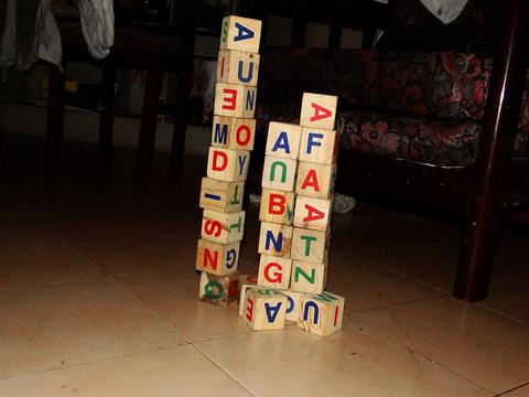 Group Four free online multiplayer game — stacked alphabet building blocks