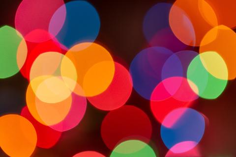 Orb Arena free online multiplayer game — colorful glowing bokeh lights